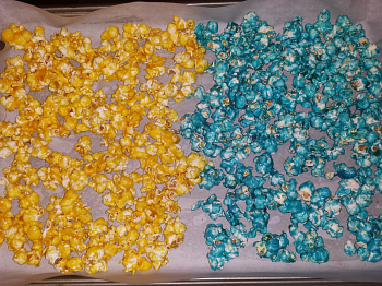 Rainbow Popcorn - Place 2 colors on parchment covered baking sheet